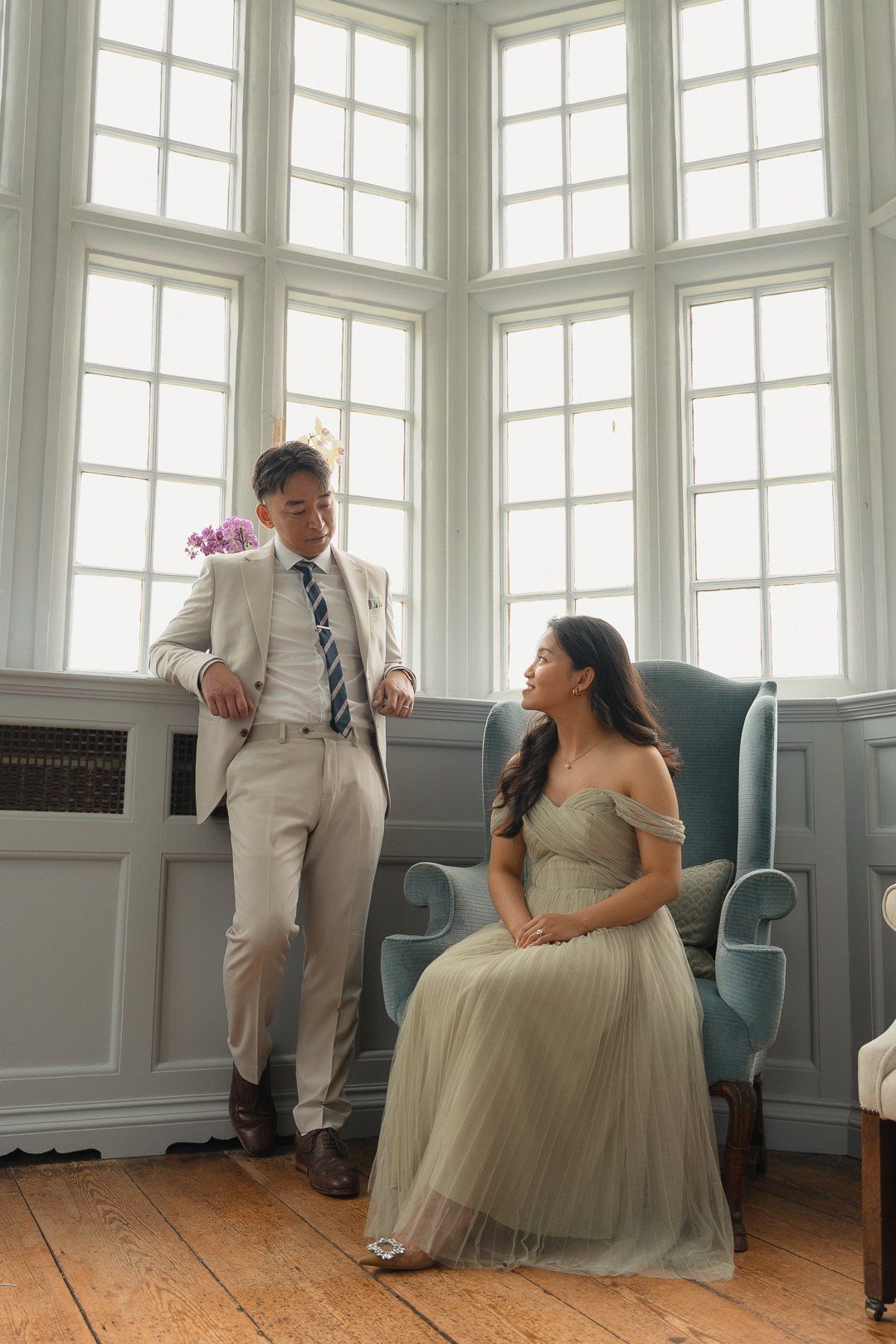 Bride and groom in a window-lit room